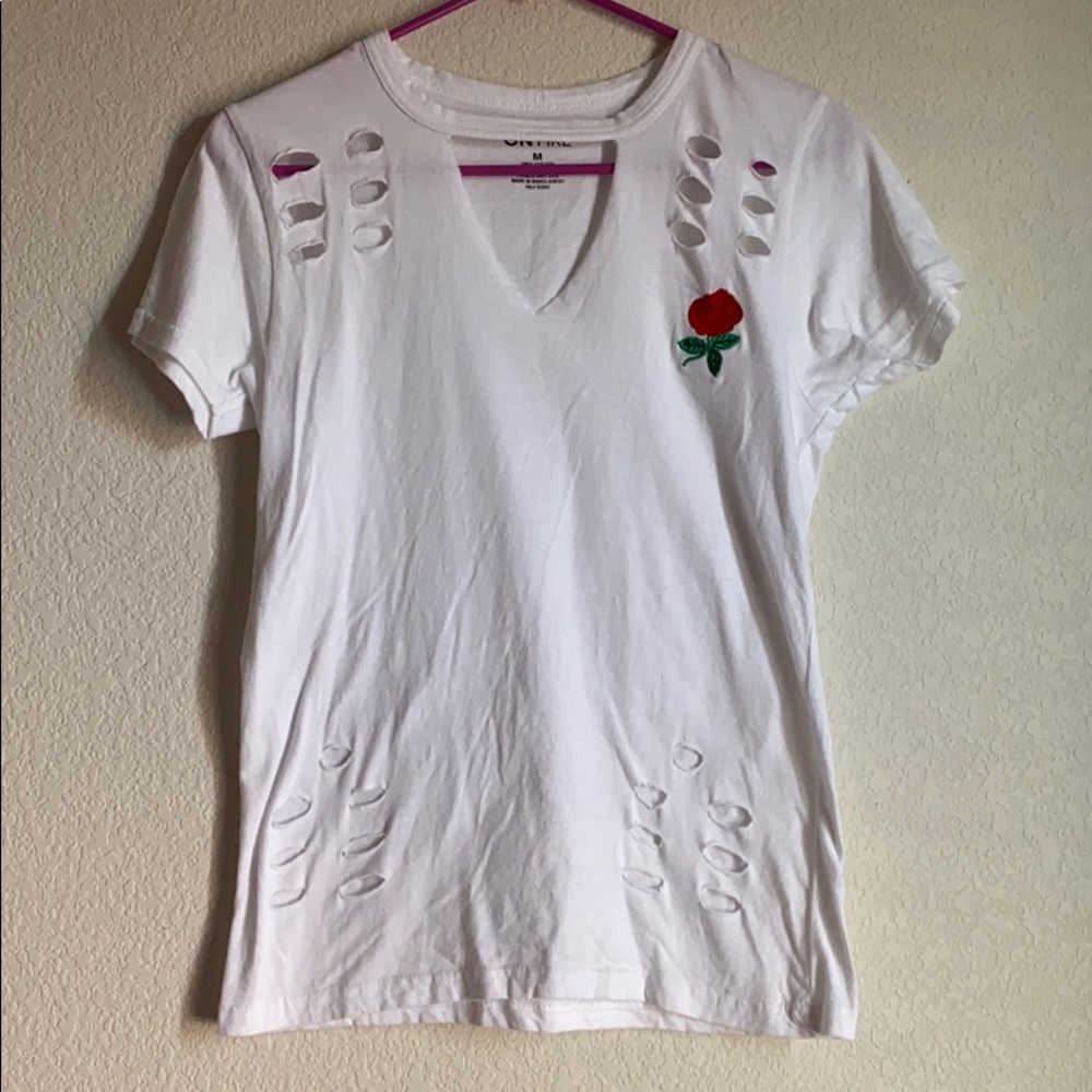 White t-shirt with v neck with collar connected.